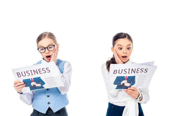 Shocked Schoolgirls Formal Wear Reading Business Newspapers Isolated White — Stock Photo, Image