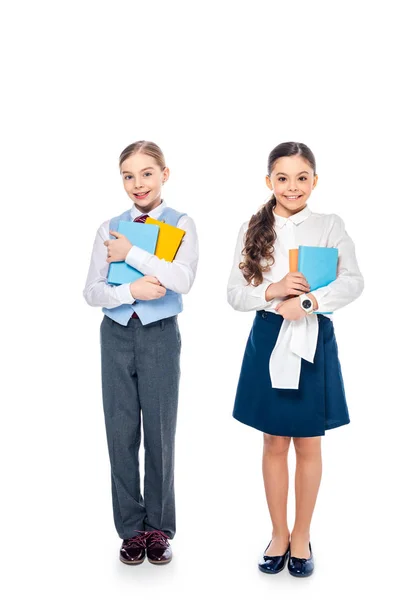 Colegialas Sonrientes Ropa Formal Sosteniendo Libros Mirando Cámara Blanco — Foto de Stock