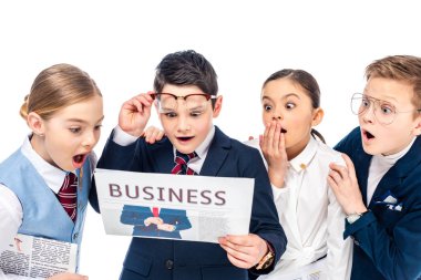 shocked schoolchildren pretending to be businesspeople reading newspaper Isolated On White clipart