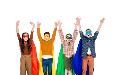 excited kids in superhero costumes and masks with Raised Hands isolated On White clipart