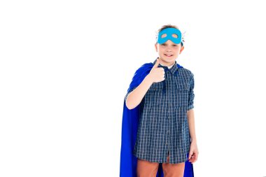 happy boy in superhero costume showing thumb up sign Isolated On White with copy space clipart
