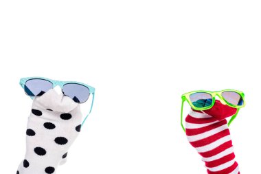 cropped view of person with colorful sock puppets and sunglasses on hands Isolated On White  clipart