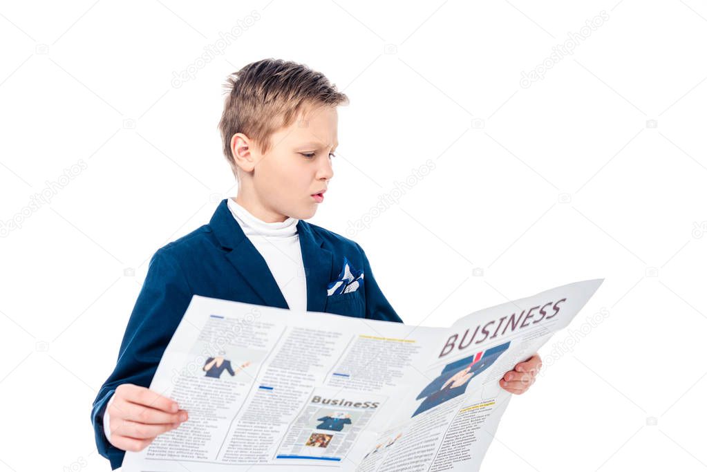 confused schoolboy in formal wear reading business newspaper Isolated On White