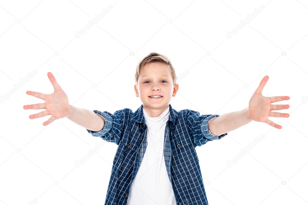 adorable smiling boy in casual clothes with outstretched hands isolated on white