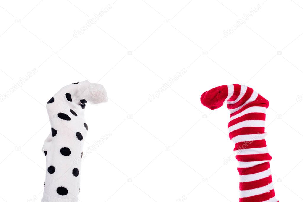 cropped view of person with colorful sock puppets on hands Isolated On White 