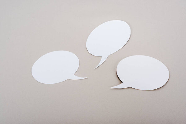 white blank speech bubbles with copy space on grey background