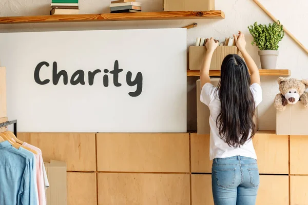 Back View Volunteer Girl Getting Cardboard Box Books Shelf — Stock Photo, Image