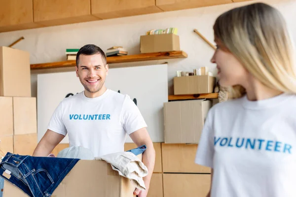 Selective Focus Young Handsome Man Holding Cardboard Box Pretty Volunteer — Stock Photo, Image