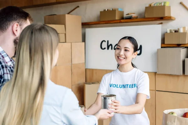 Pretty Asian Volunteer Giving Canned Food Man Woman Charity Center — Stock Photo, Image