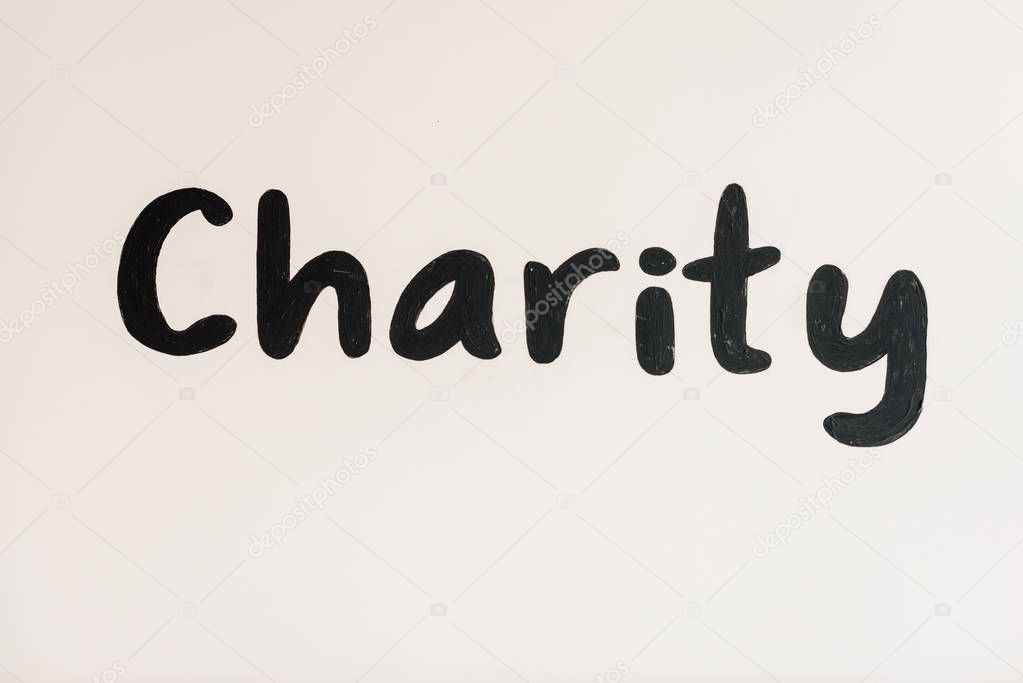 black handwritten charity inscription on white with copy space