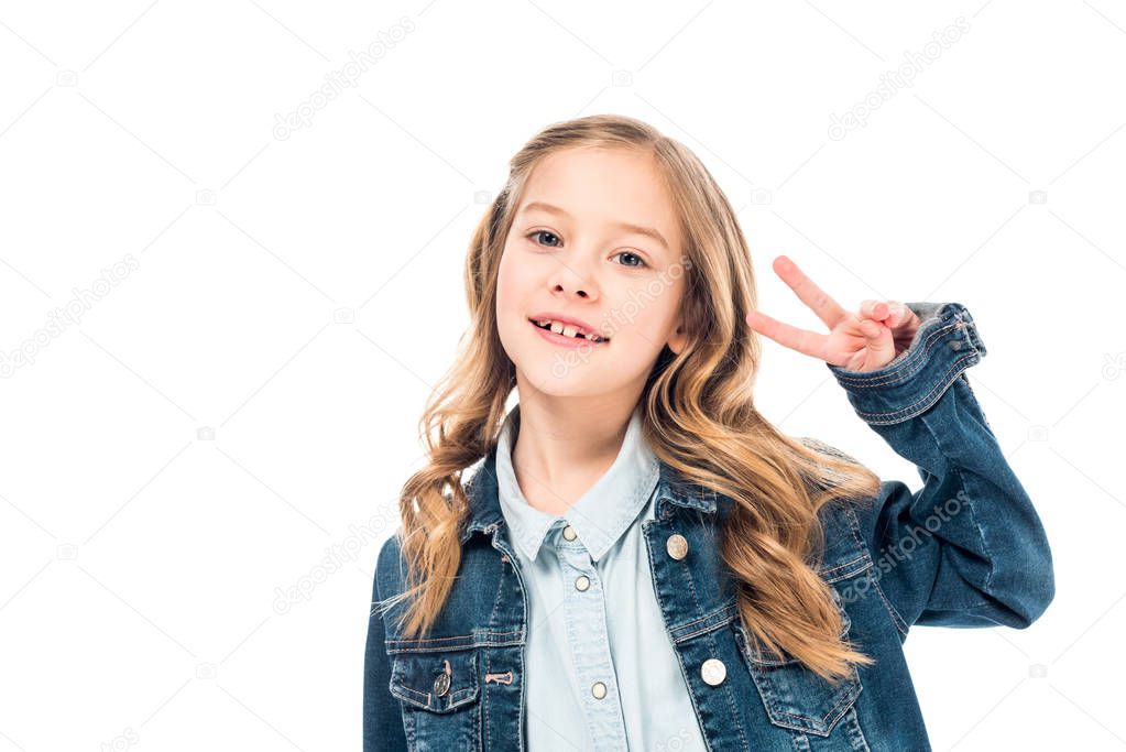 smiling kid in denim jacket showing peace sign isolated on white