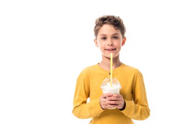 front view of happy kid holding milkshake isolated on white