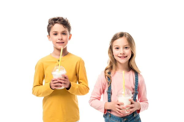 Two Smiling Kids Holding Milkshakes Isolated White Royalty Free Stock Images