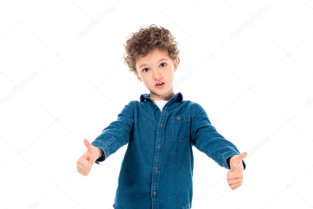 emotional kid in denim shirt showing thumbs up isolated on white