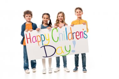 full length view of smiling kids holding placard on white clipart
