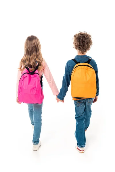 Visão Traseira Escolares Com Mochilas Mãos Dadas Isoladas Branco — Fotografia de Stock