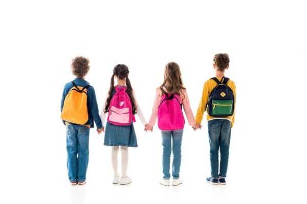 Visão Traseira Escolares Com Mochilas Mãos Dadas Isoladas Branco — Fotografia de Stock