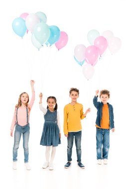 full length view of four kids holding balloons isolated on white clipart