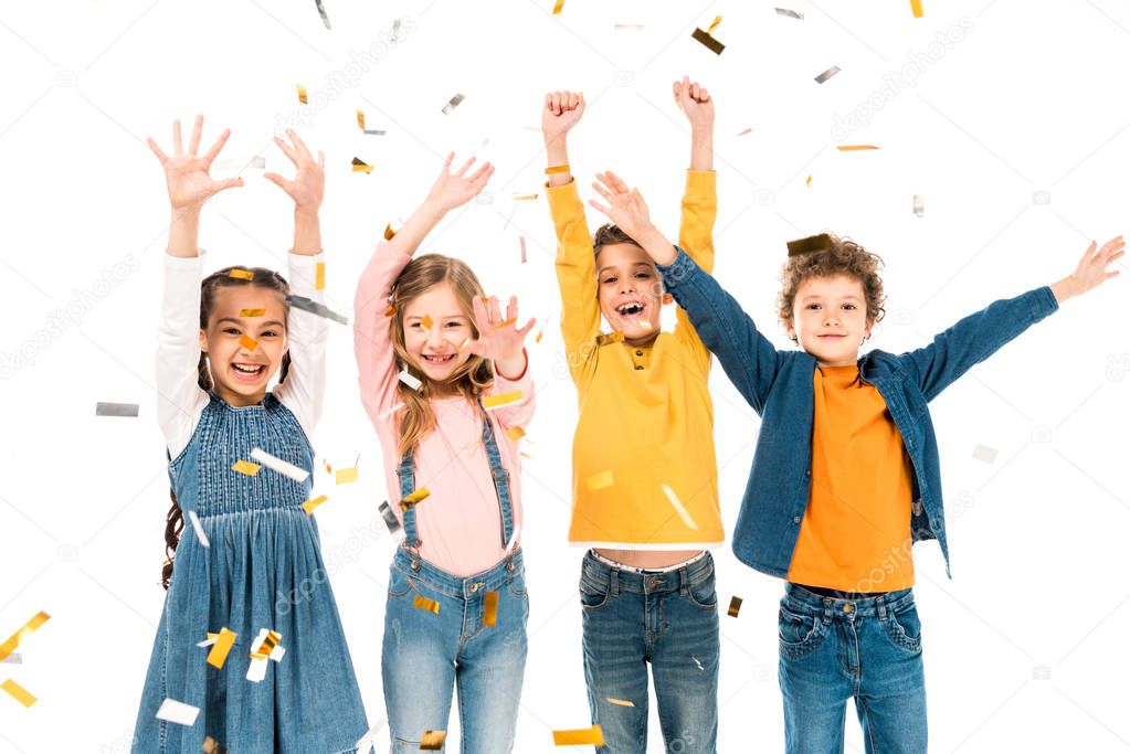 four happy kids waving hands under confetti isolated on white