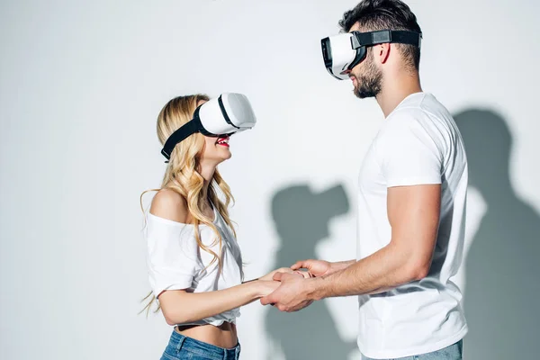 Happy Man Holding Hands Blonde Woman While Wearing Virtual Reality — Stock Photo, Image