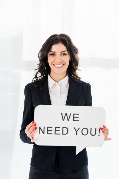 happy and beautiful recruiter holding speech bubble with we need you lettering 