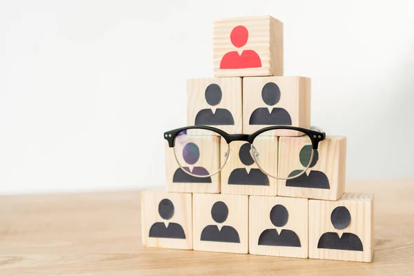 Management hierarchy pyramid and glasses on white with copy space — Stock Image Management Hierarchy Pyramid Glasses White Copy Space Royalty Free Stock Photos