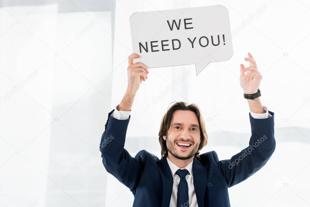 cheerful recruiter holding speech bubble with we need you lettering 
