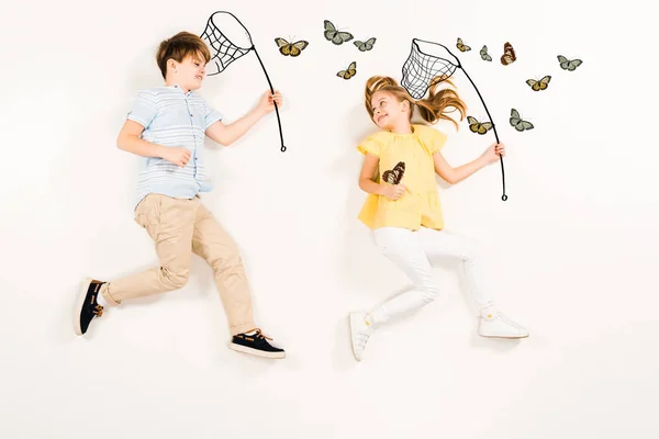 Top View Cheerful Kids Butterfly Nets Smiling Butterflies White — Stock Photo, Image