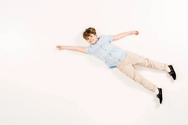 Happy Child Looking Camera Gesturing While Lying White — Stock Photo, Image