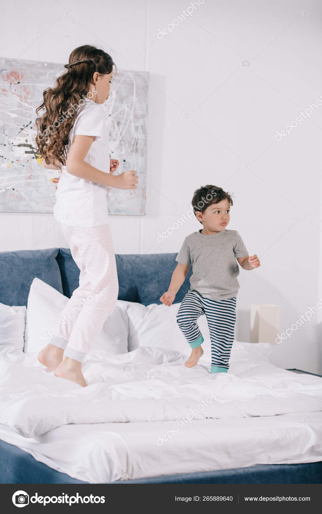 Cute Child Jumping Bed Adorable Toddler Brother — Stock Photo © IgorVetushko 265889640