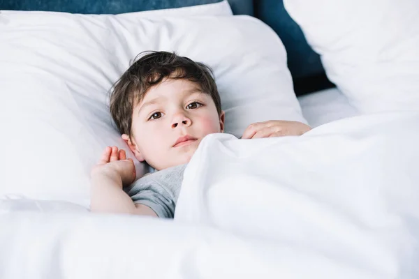 Cute Kid Lying White Pillow Bed Looking Camera — Stock Photo, Image