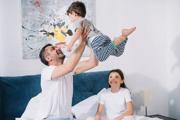 Happy Kid Looking Father Holding Arms Toddler Brother — Stock Photo, Image