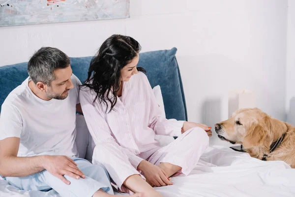 Happy Woman Touching Cute Golden Retriever While Sitting Bed Man — Stock Photo, Image