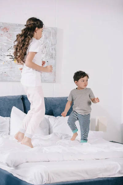 Cute Child Jumping Bed Adorable Toddler Brother — Stock Photo, Image