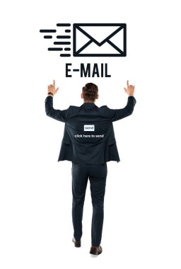 back view of businessman pointing with fingers at e-mail lettering while standing on white  clipart