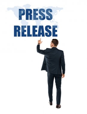 back view of man pointing with finger at press release lettering while standing on white  clipart