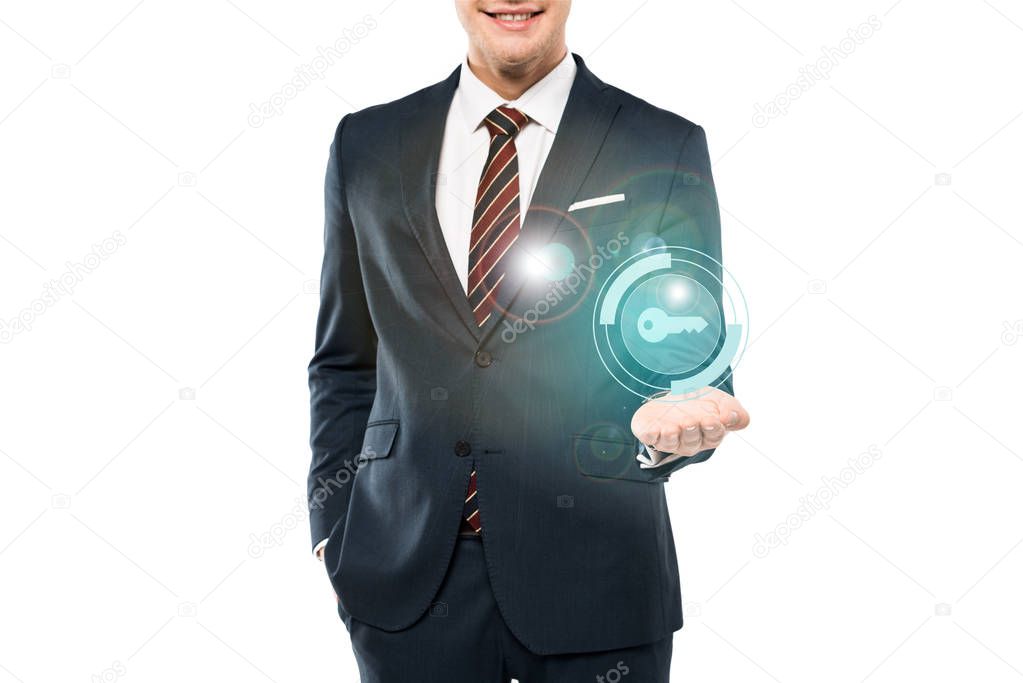 cropped view of cheerful man in suit smiling and gesturing near key icon on white