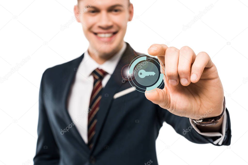 selective focus of happy businessman gesturing and smiling while touching virtual key icon isolated on while 