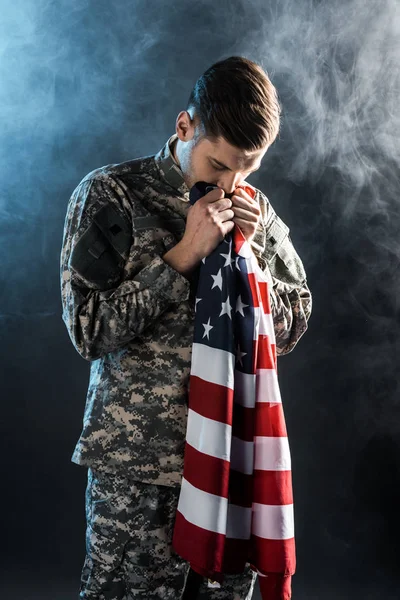 Handsome Soldier Closed Eyes Smelling American Flag Black Smoke — Stock Photo, Image