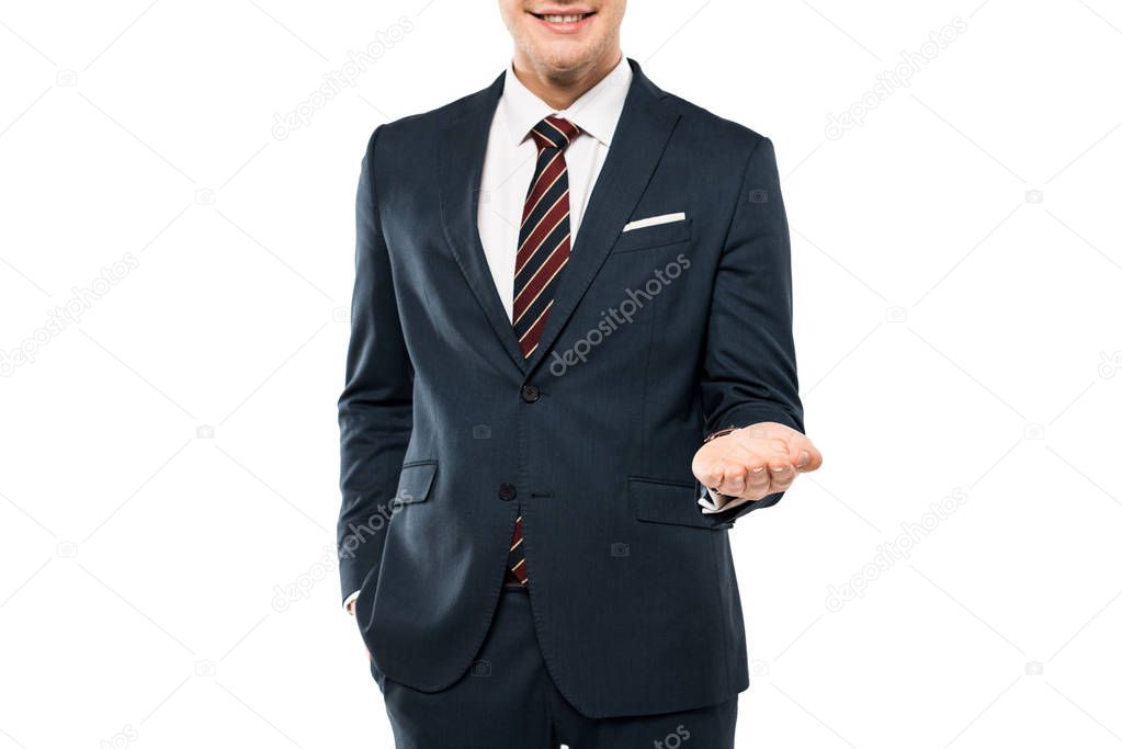 cropped view of cheerful man in suit smiling and gesturing isolated on white 