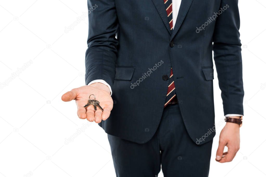 cropped view of businessman holding keys in hand isolated on white 