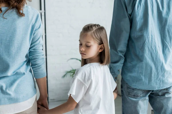 Upset Kid Standing Parents Holding Hands Home — Stock Photo, Image