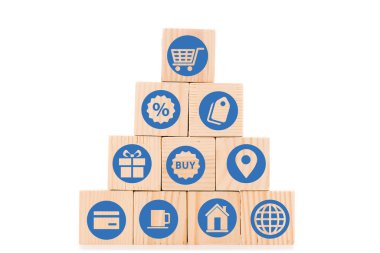 pyramid made of wooden blocks with blue shopping icons isolated on white clipart