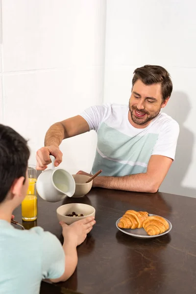 Dad Pouring Milk Bowl Breakfast Son — Stock Photo, Image