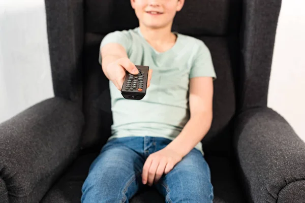 Boy Jeans Sitting Armchair Holding Remote Controller — Stock Photo, Image
