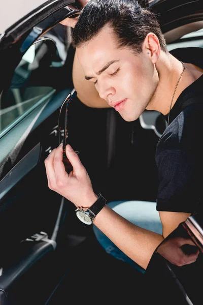 Handsome Stylish Man Holding Sunglasses Posing While Sitting Car — Stock Photo, Image