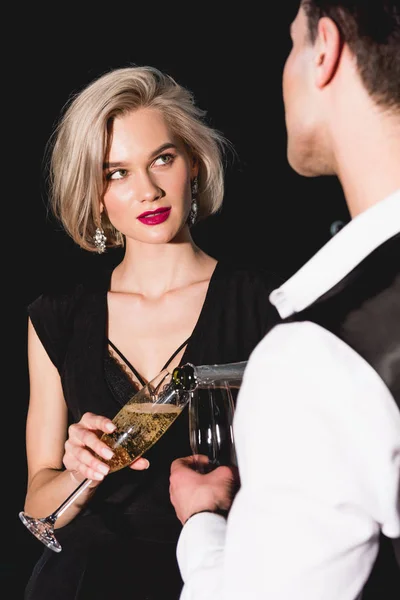 Man Pouring Champagne Beautiful Fashionable Young Woman — Stock Photo, Image