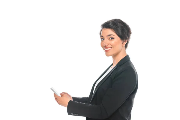 Cheerful Mixed Race Businesswoman Using Smartphone While Smiling Camera Isolated — Stock Photo, Image