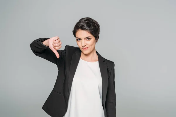 Displeased Mixed Race Businesswoman Showing Thumb While Looking Camera Isolated — Stock Photo, Image