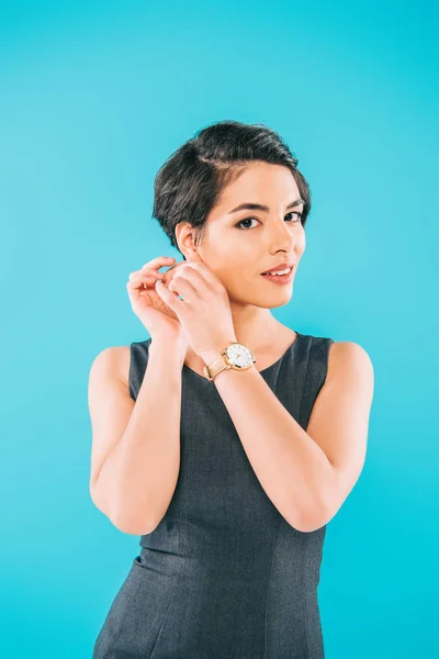 Attractive Mixed Race Woman Touching Earring While Looking Camera Isolated — Stock Photo, Image